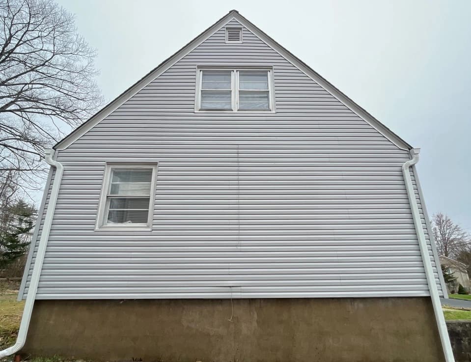 Elyria Power Washing technician performing detailed house washing in Elyria residential area